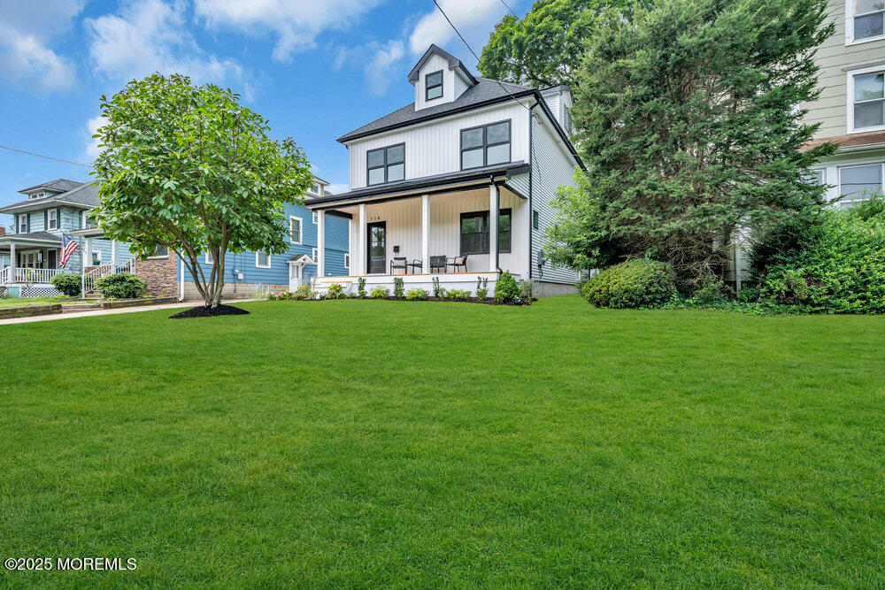 114 Harrison Avenue Red Bank, NJ 07701 - Photo 2 of 35 a front view of a house with a garden