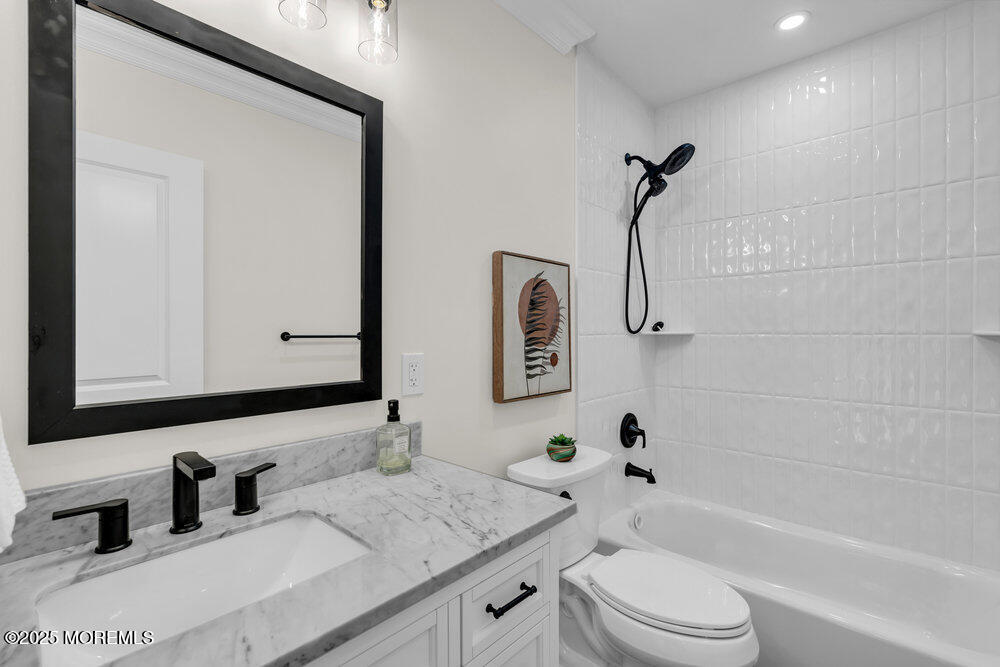 114 Harrison Avenue Red Bank, NJ 07701 - Photo 21 of 35 a bathroom with a granite countertop sink a toilet and a bathtub