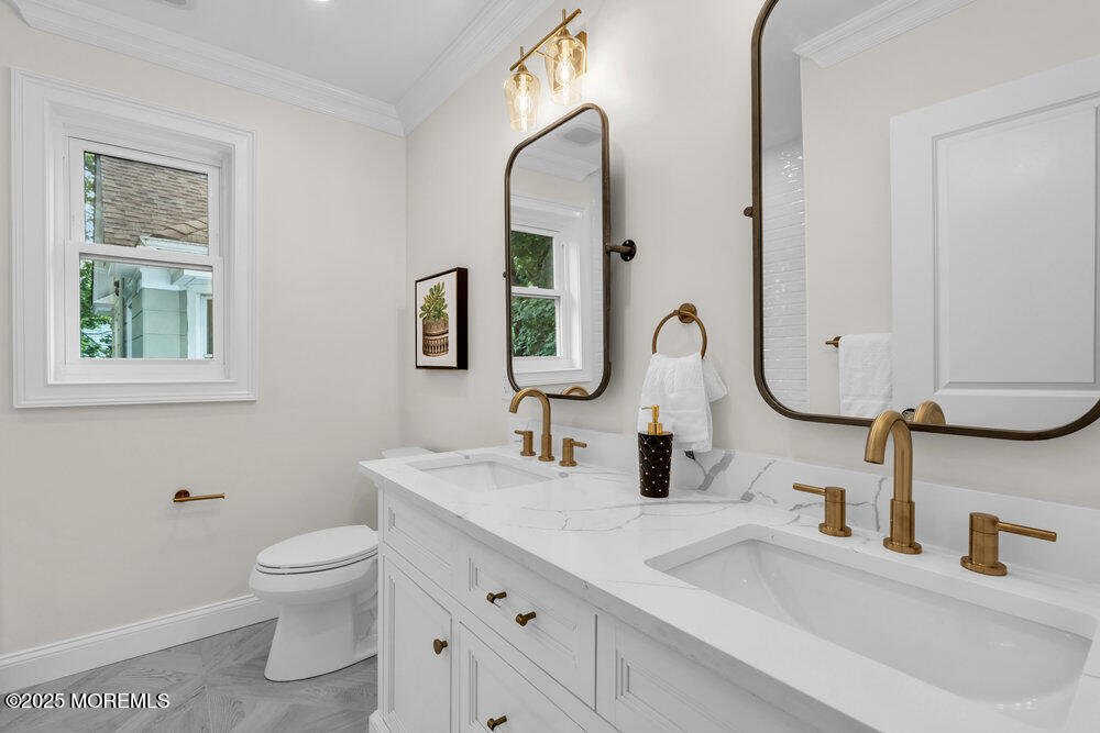 114 Harrison Avenue Red Bank, NJ 07701 - Photo 26 of 35 a bathroom with a toilet sink and mirror
