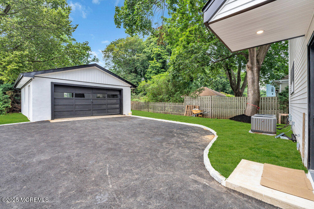 114 Harrison Avenue Red Bank, NJ 07701 - Photo 31 of 35 a view of a house with a yard and garage