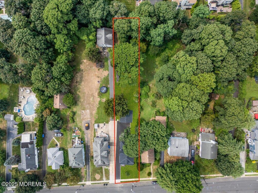 114 Harrison Avenue Red Bank, NJ 07701 - Photo 34 of 35 an aerial view of residential house with outdoor space and trees all around