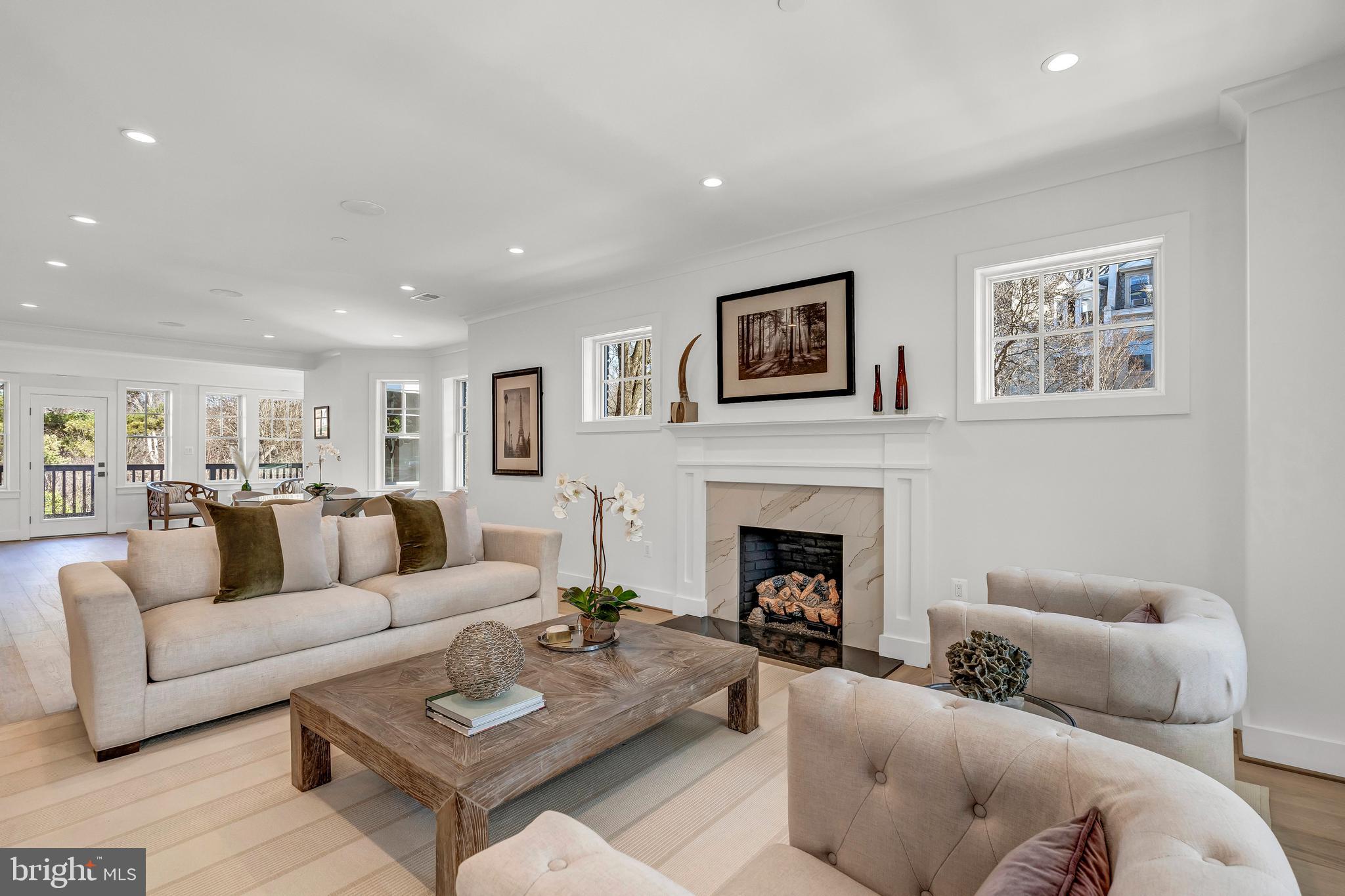2001 Klingle Road Northwest Washington, DC 20010 - Photo 11 of 50 a living room with furniture and a fireplace
