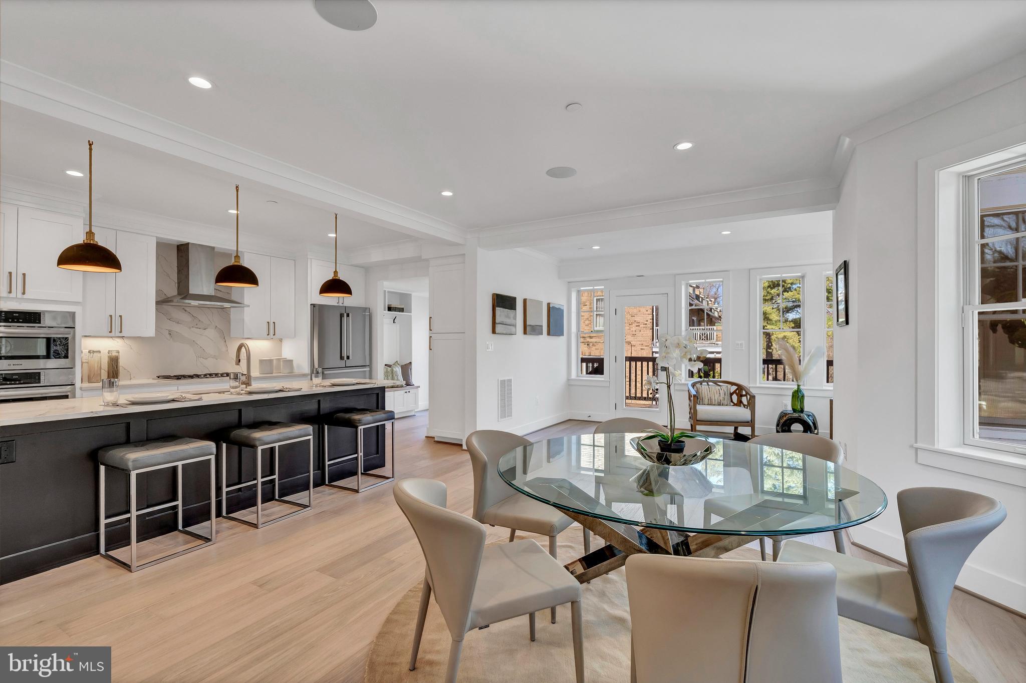 2001 Klingle Road Northwest Washington, DC 20010 - Photo 15 of 50 a kitchen with stainless steel appliances granite countertop a dining table chairs and view living room