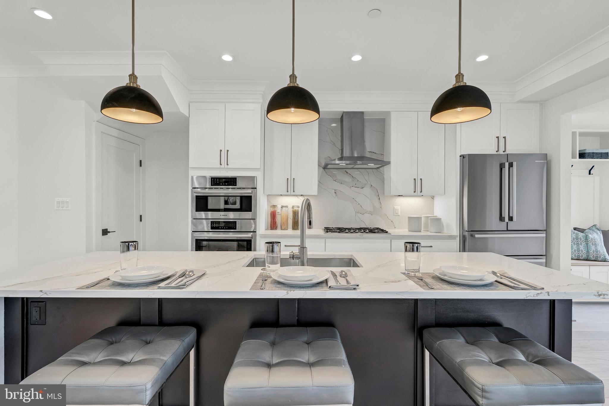2001 Klingle Road Northwest Washington, DC 20010 - Photo 20 of 50 a kitchen with kitchen island stainless steel appliances a sink and a stove