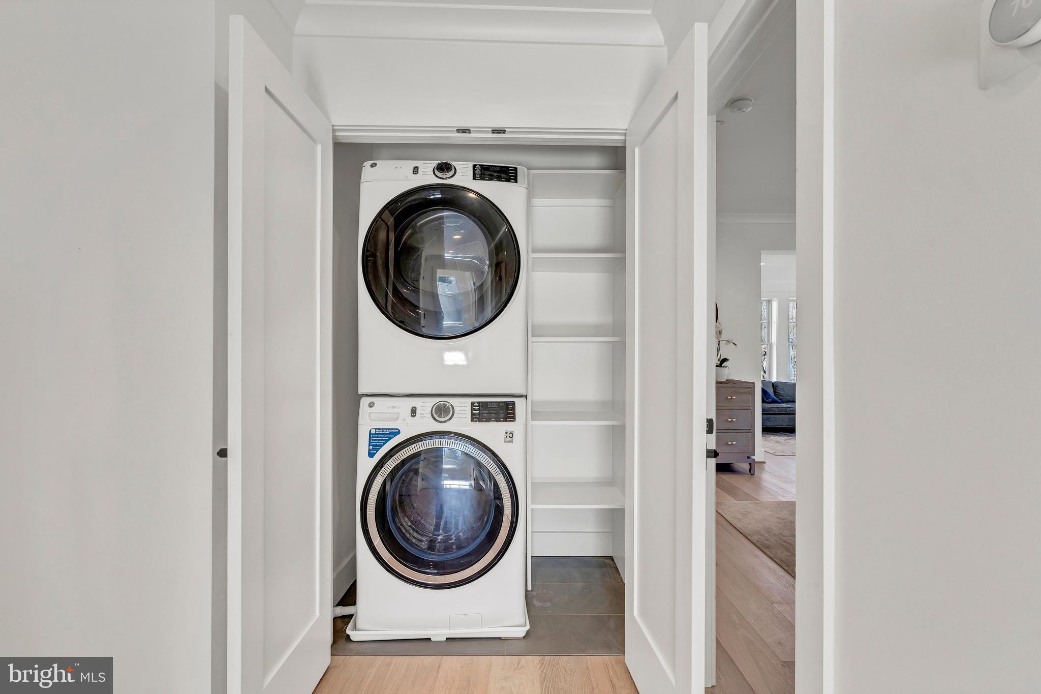 2001 Klingle Road Northwest Washington, DC 20010 - Photo 27 of 50 a view of a hallway with washer and dryer