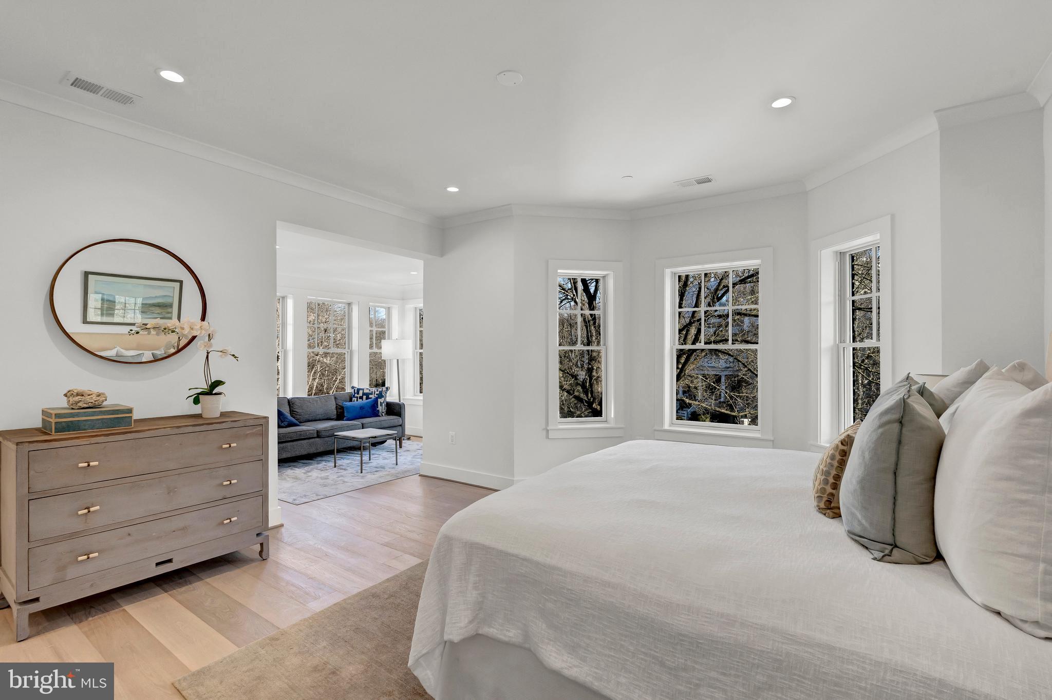 2001 Klingle Road Northwest Washington, DC 20010 - Photo 29 of 50 a spacious bedroom with a bed a dresser and a window