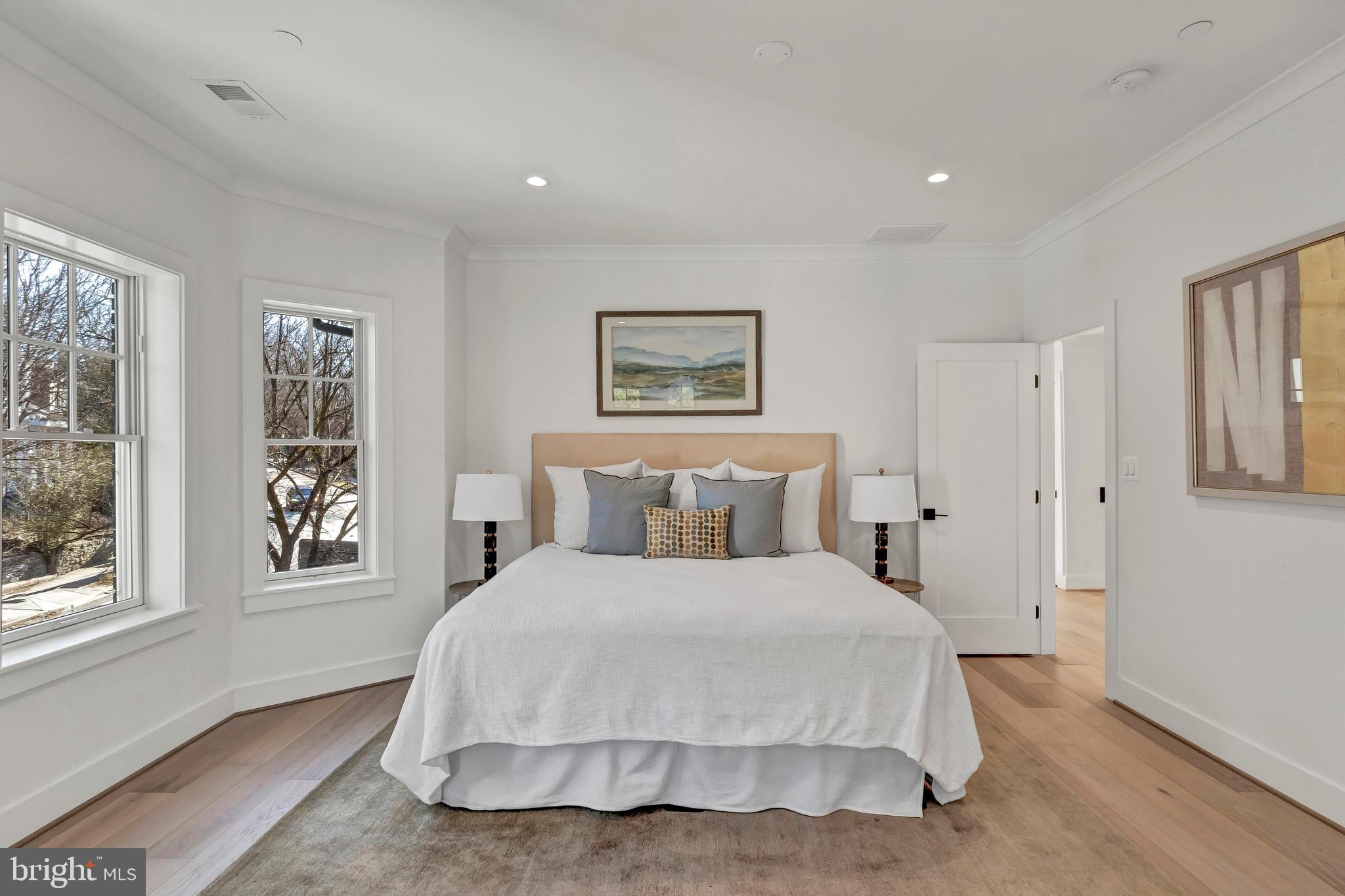 2001 Klingle Road Northwest Washington, DC 20010 - Photo 32 of 50 a bedroom with a bed and a window