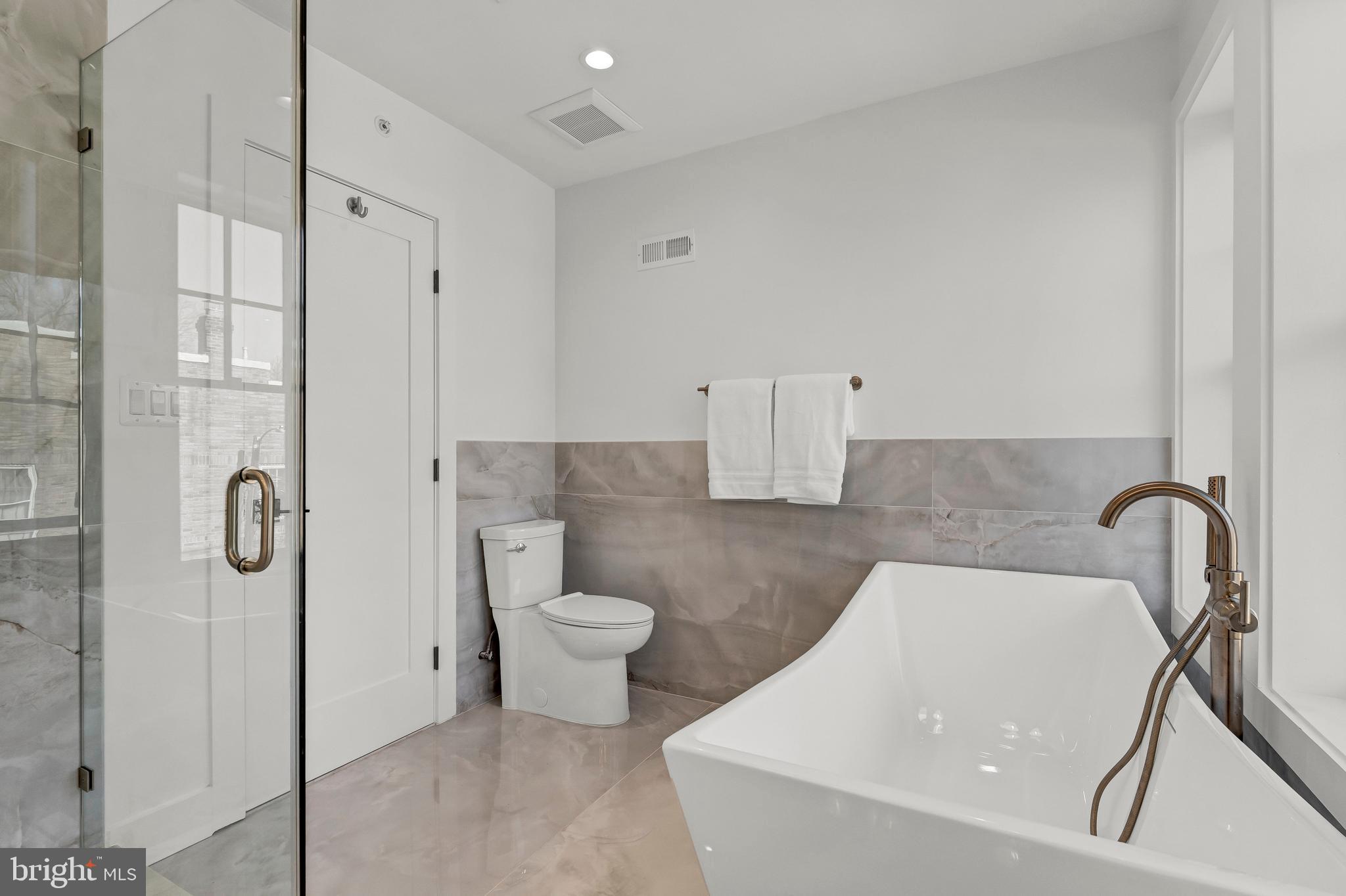 2001 Klingle Road Northwest Washington, DC 20010 - Photo 38 of 50 a bathroom with a toilet sink and shower