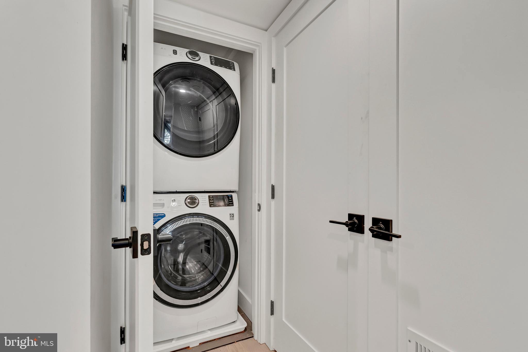 2001 Klingle Road Northwest Washington, DC 20010 - Photo 49 of 50 a view of a hallway with washer and dryer
