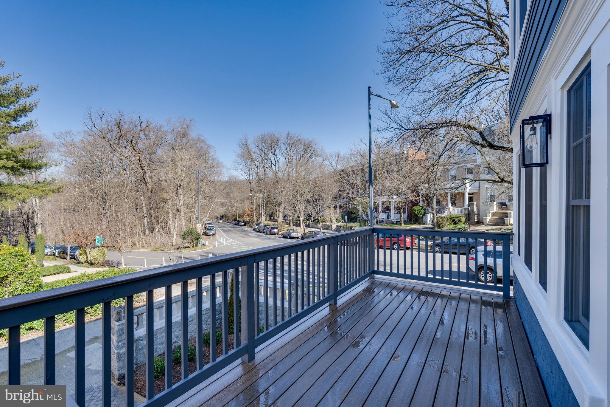 2001 Klingle Road Northwest Washington, DC 20010 - Photo 5 of 50 a balcony with wooden floor and fence