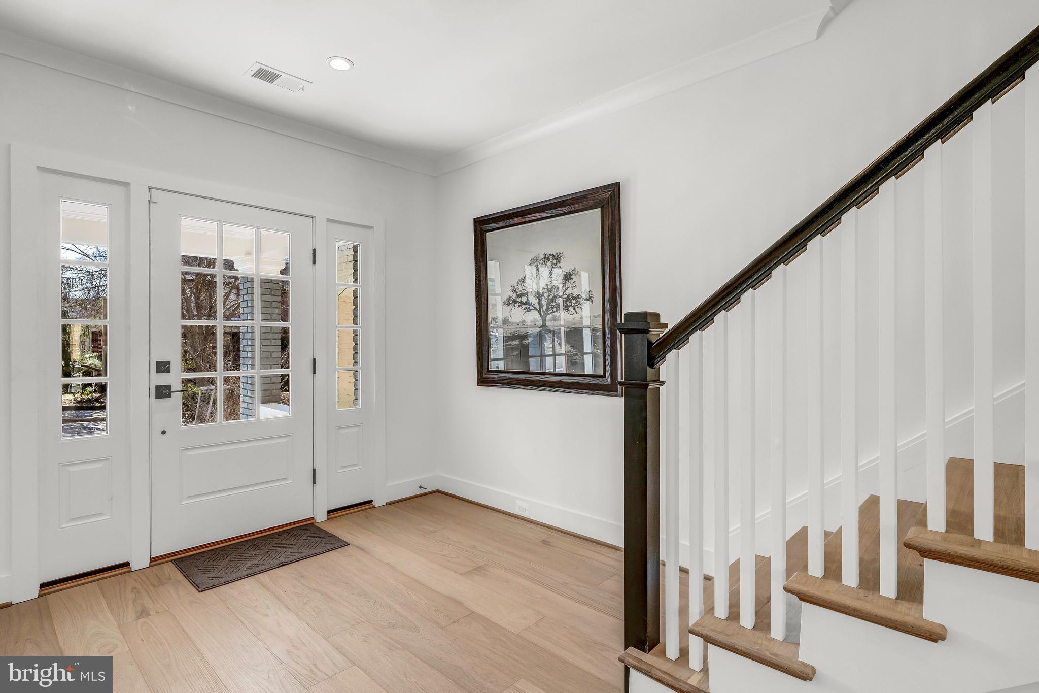2001 Klingle Road Northwest Washington, DC 20010 - Photo 6 of 50 an entryway with wooden floor and stairs
