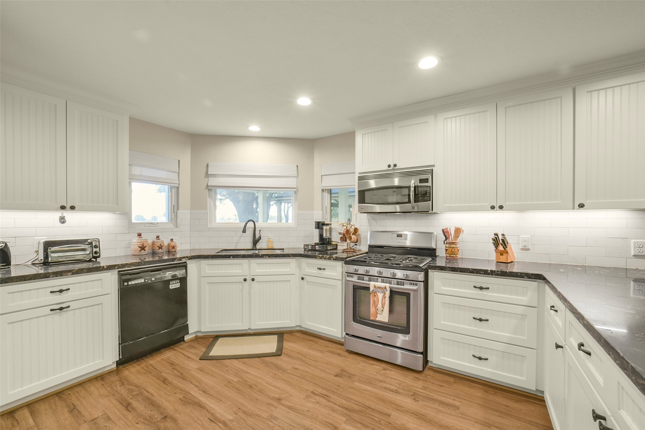 29103 Quail Nest Road Hockley, TX 77447 - Photo 5 of 49 Large open kitchen with granite countertops and an abundance of cabinets