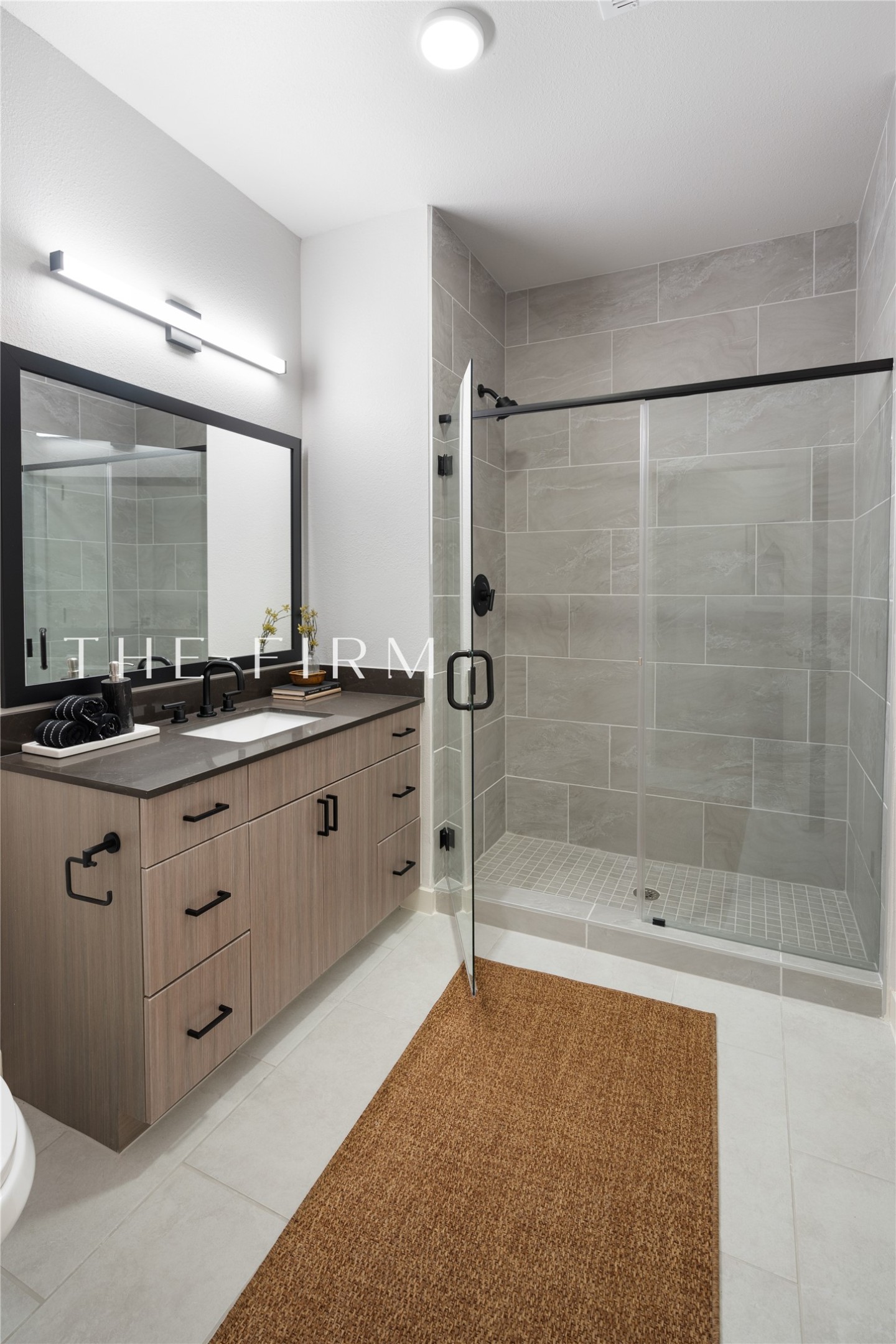 3001 West 11th Street, Unit 575 Houston, TX 77008 - Photo 14 of 20 a spacious bathroom with a double vanity sink mirror and shower