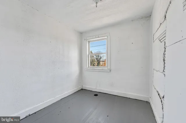 a view of room with window and closet