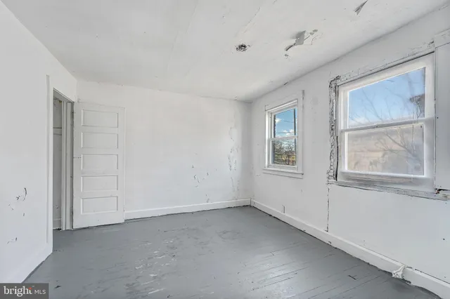 a view of empty room with windows