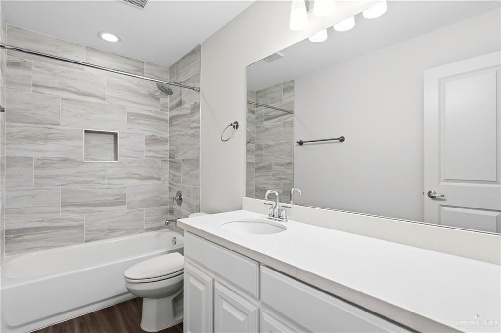 14221 Chalk Rdg Drive McAllen, TX 78504 - Photo 15 of 17 a bathroom with a sink a toilet and shower