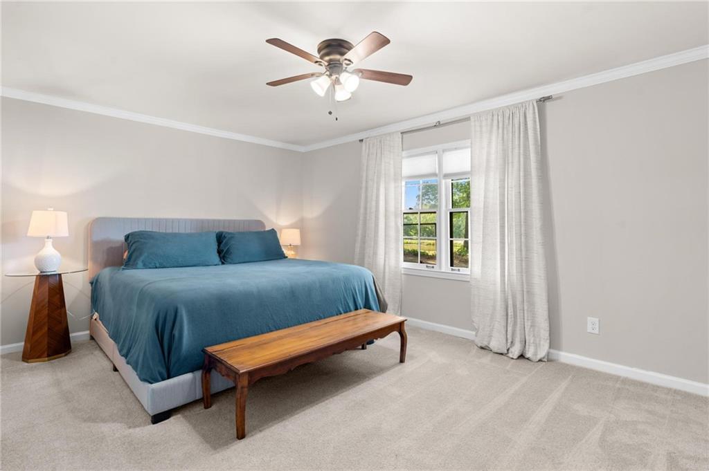 34 Chaumont Square Northwest Atlanta, GA 30327 - Photo 22 of 42 a bedroom with a bed and window