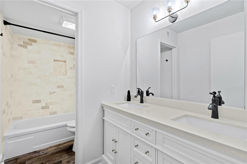 34 Chaumont Square Northwest Atlanta, GA 30327 - Photo 24 of 42 a bathroom with a bathtub and a sink