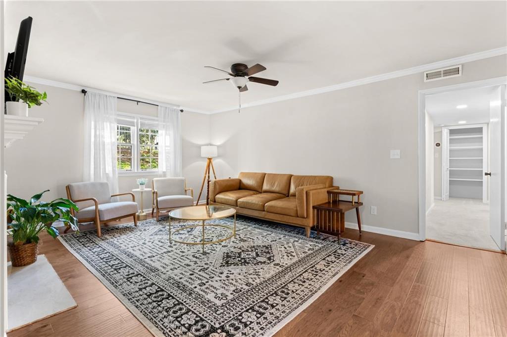 34 Chaumont Square Northwest Atlanta, GA 30327 - Photo 3 of 42 a living room with furniture rug and window