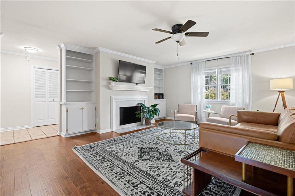 34 Chaumont Square Northwest Atlanta, GA 30327 - Photo 5 of 42 a living room with furniture and a fireplace