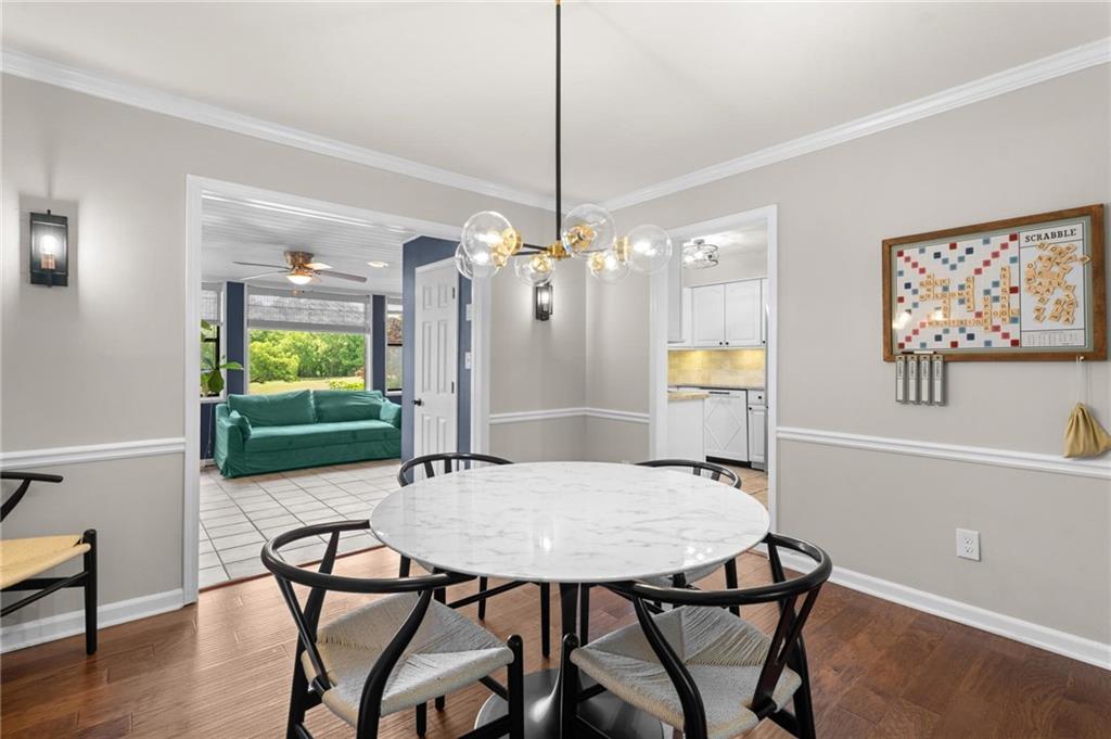 34 Chaumont Square Northwest Atlanta, GA 30327 - Photo 9 of 42 a view of a dining room with furniture and wooden floor