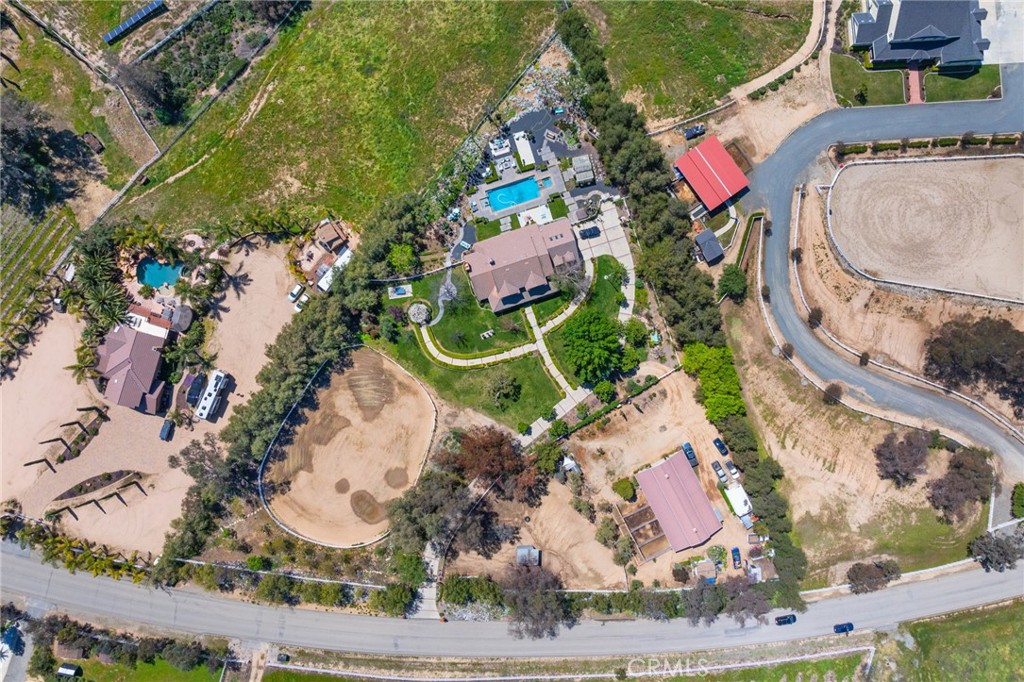 39817 Calle Cabernet Temecula, CA 92591 - Photo 17 of 75 an aerial view of a house with a swimming pool