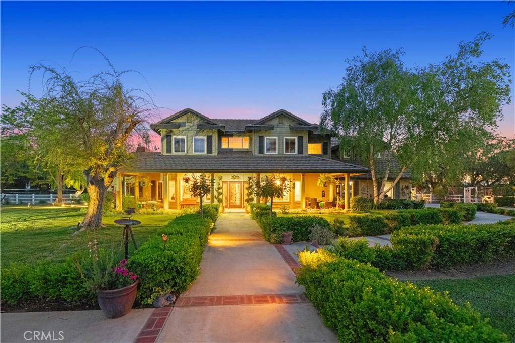 39817 Calle Cabernet Temecula, CA 92591 - Photo 19 of 75 a front view of a house with a yard and potted plants