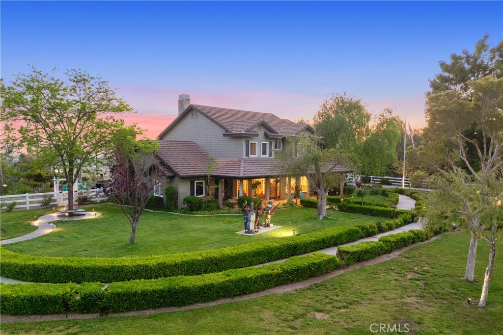 39817 Calle Cabernet Temecula, CA 92591 - Photo 2 of 75 a front view of a house with a yard