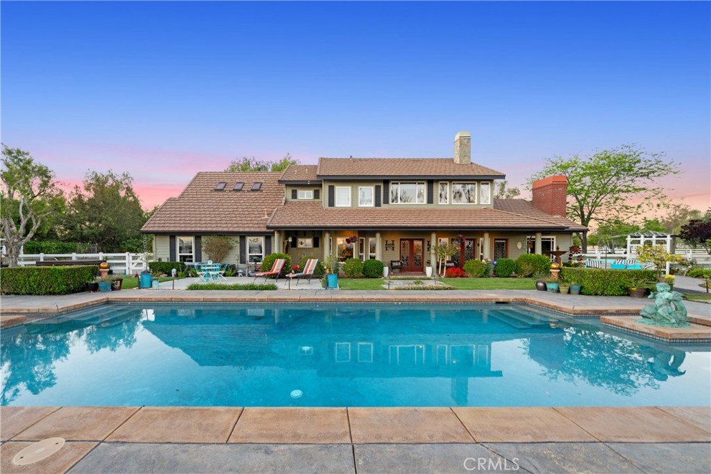 39817 Calle Cabernet Temecula, CA 92591 - Photo 21 of 75 a front view of a house with swimming pool having outdoor seating