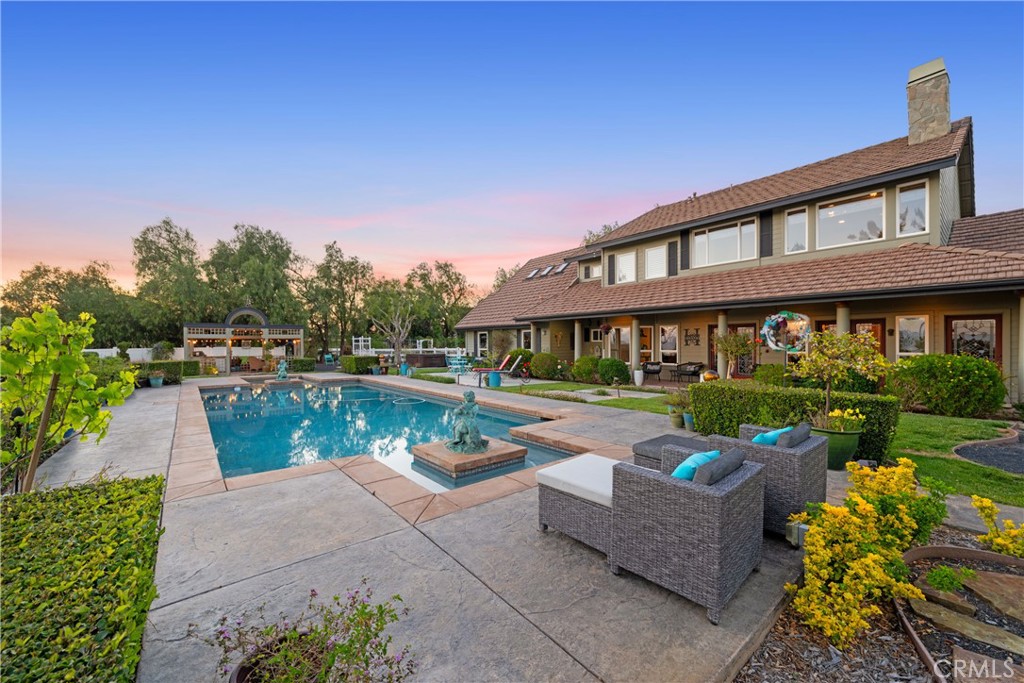39817 Calle Cabernet Temecula, CA 92591 - Photo 24 of 75 a view of house with swimming pool and outdoor seating