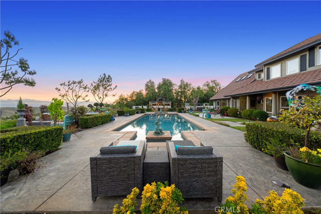 39817 Calle Cabernet Temecula, CA 92591 - Photo 25 of 75 a view of a swimming pool with a patio
