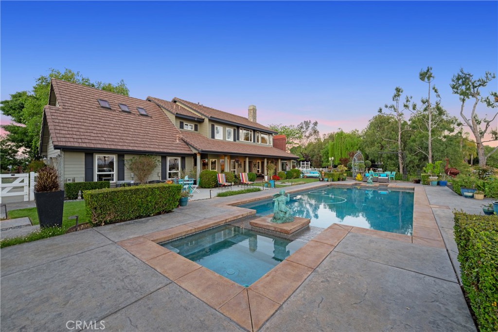 39817 Calle Cabernet Temecula, CA 92591 - Photo 26 of 75 a view of house with swimming pool and a yard