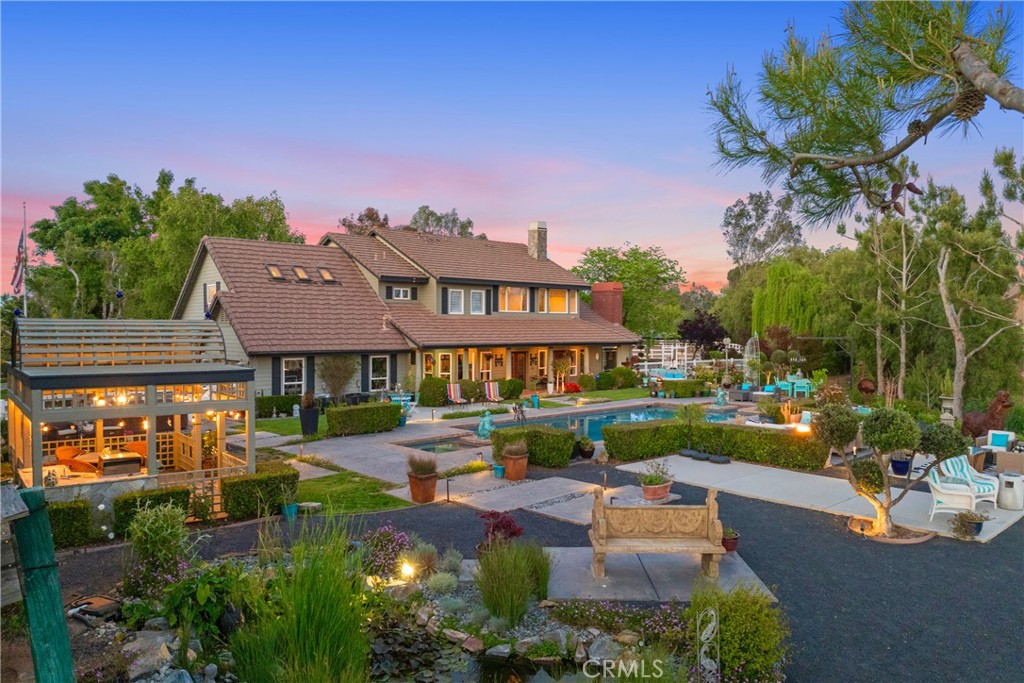39817 Calle Cabernet Temecula, CA 92591 - Photo 3 of 75 a front view of a house with garden