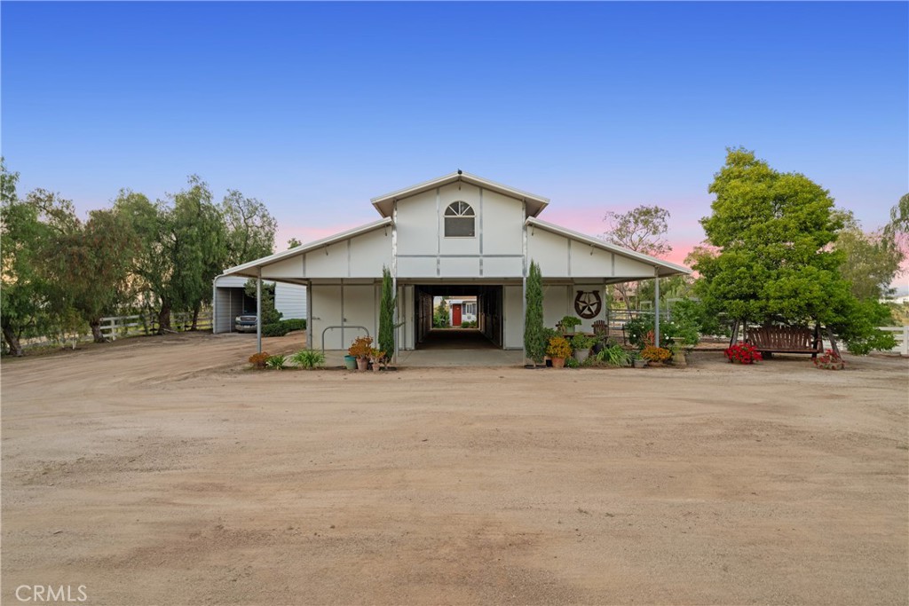 39817 Calle Cabernet Temecula, CA 92591 - Photo 37 of 75 a front view of a house with a yard and garage