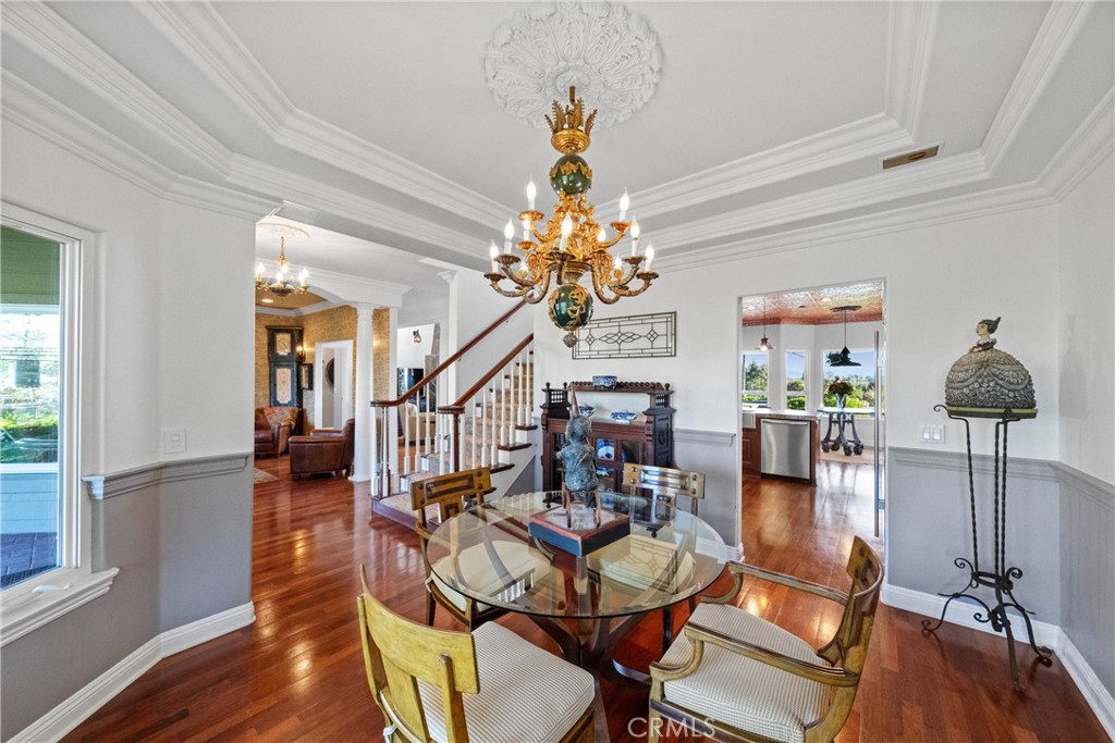 39817 Calle Cabernet Temecula, CA 92591 - Photo 49 of 75 a dining room with wooden floor table and chairs