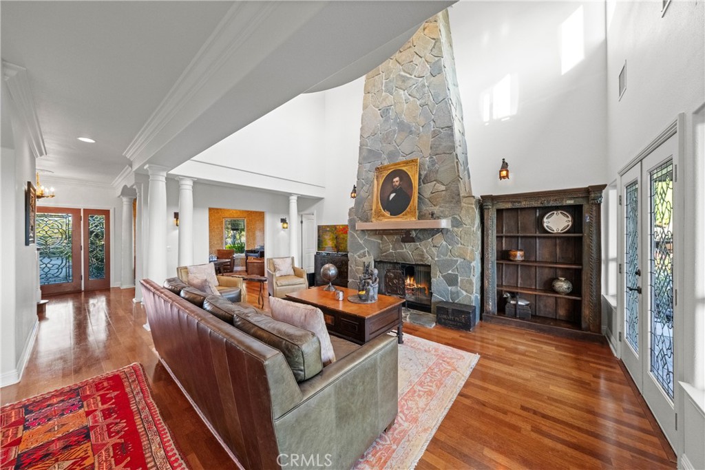 39817 Calle Cabernet Temecula, CA 92591 - Photo 57 of 75 a living room with furniture and a fireplace