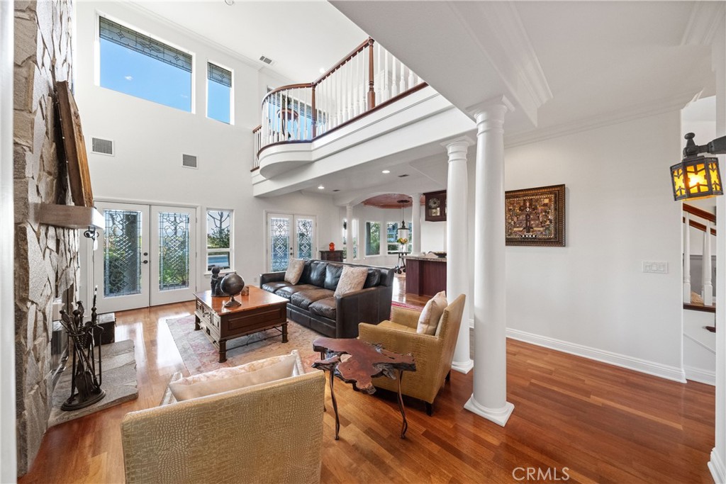 39817 Calle Cabernet Temecula, CA 92591 - Photo 60 of 75 a living room with furniture wooden floor and a large window