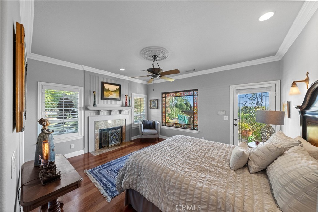 39817 Calle Cabernet Temecula, CA 92591 - Photo 61 of 75 a bedroom with a bed and a fireplace