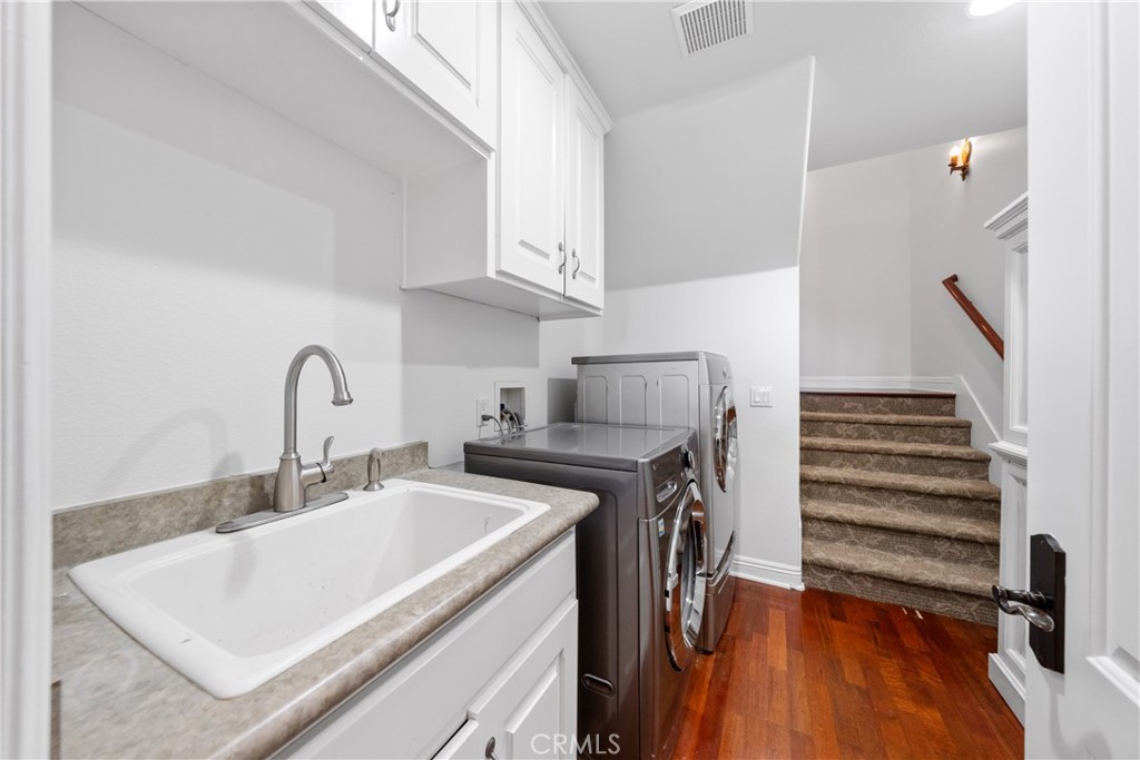 39817 Calle Cabernet Temecula, CA 92591 - Photo 67 of 75 a view of a kitchen with sink and washing machine