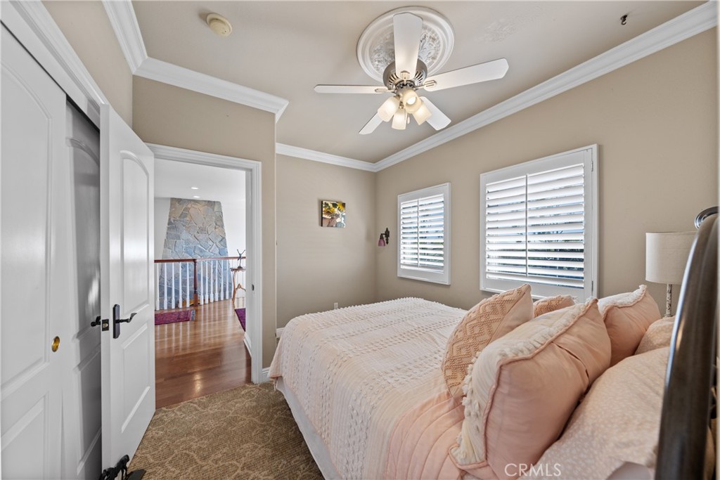 39817 Calle Cabernet Temecula, CA 92591 - Photo 71 of 75 a bedroom with a bed and a chandelier