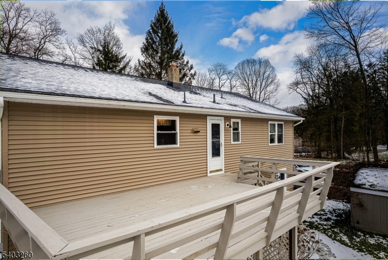 9 Wehrli Road Long Valley, NJ 07853 - Photo 5 of 35 a view of a white house with a large window and couches