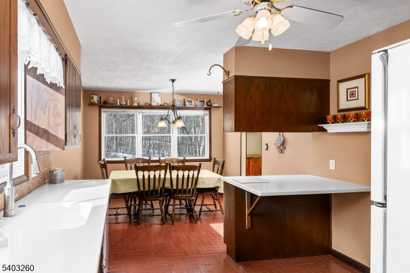 9 Wehrli Road Long Valley, NJ 07853 - Photo 10 of 35 a living room with furniture a piano and a flat screen tv