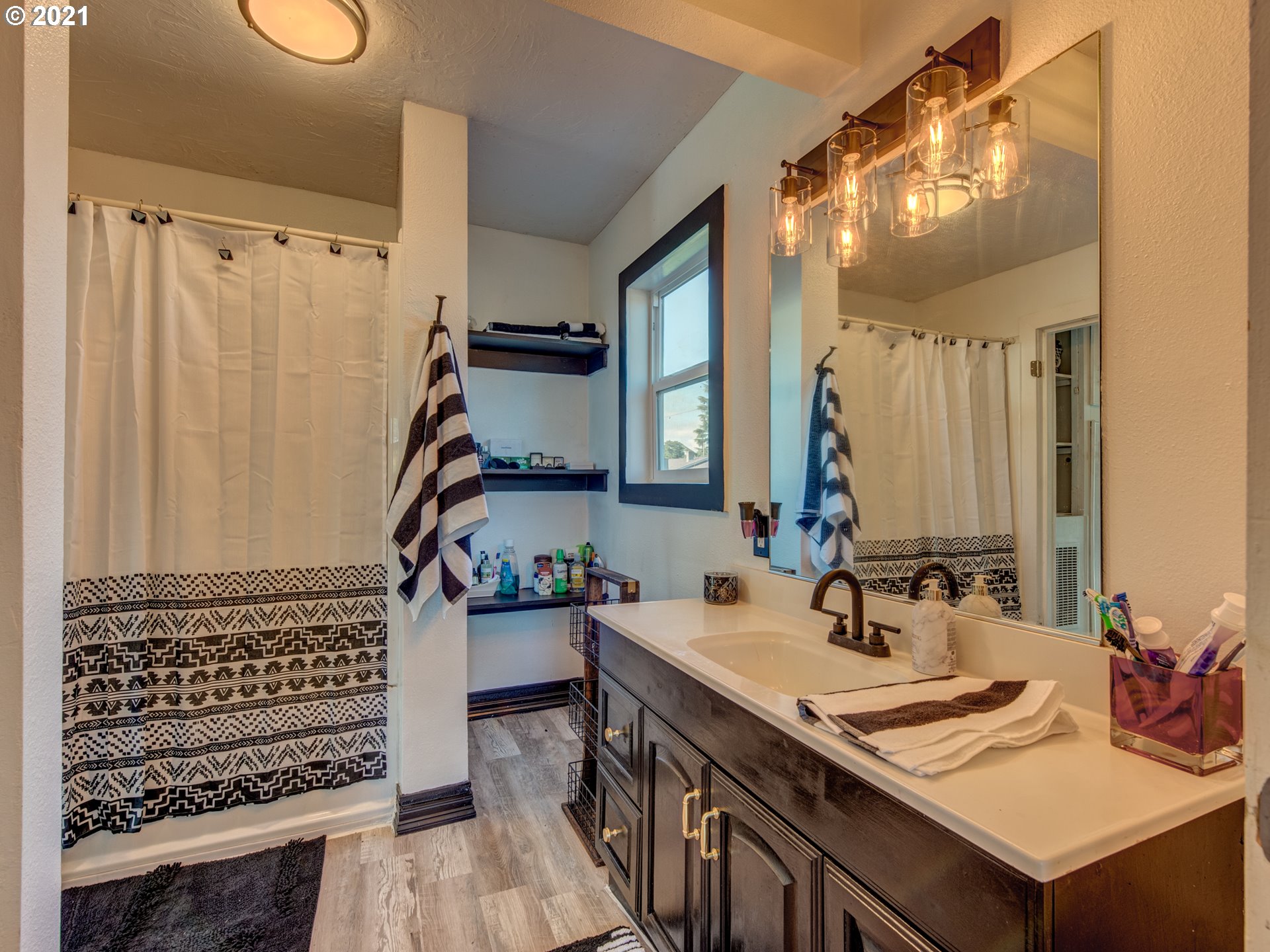 580 54th Street Springfield, OR 97478 - Photo 18 of 31 a bathroom with a sink double vanity and a mirror