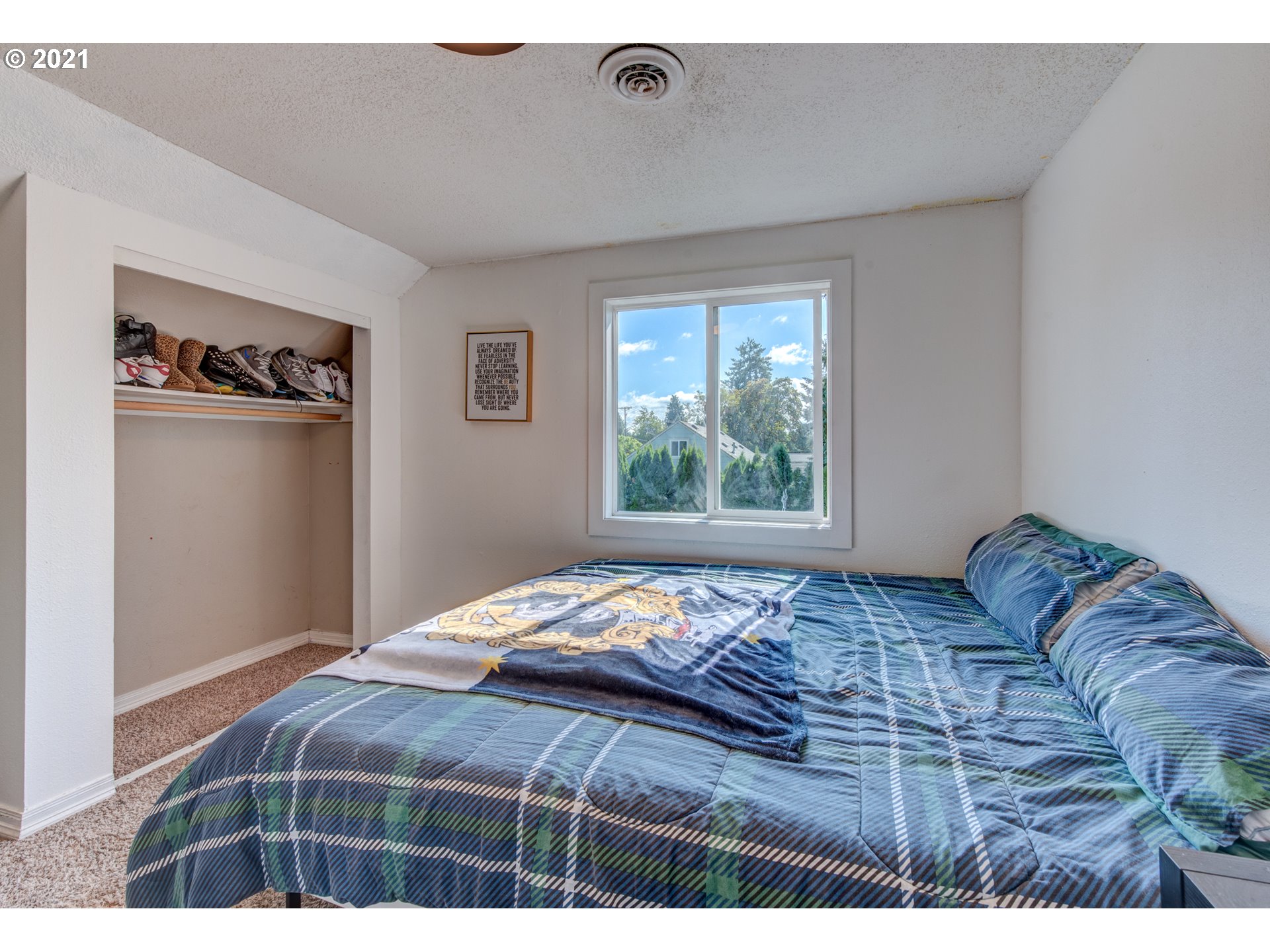 580 54th Street Springfield, OR 97478 - Photo 21 of 31 a bedroom with a bed and a window