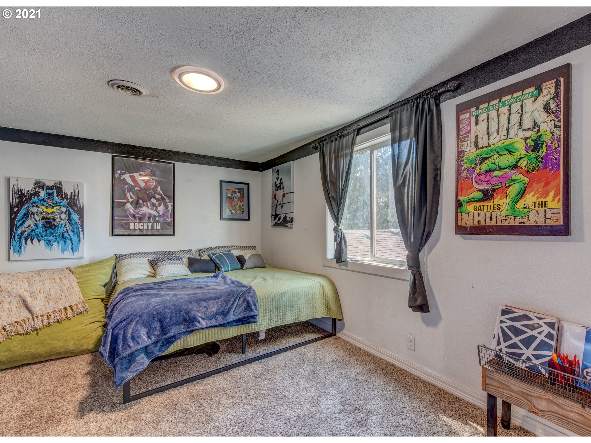 580 54th Street Springfield, OR 97478 - Photo 24 of 31 a bedroom with a bed and a painting on the wall