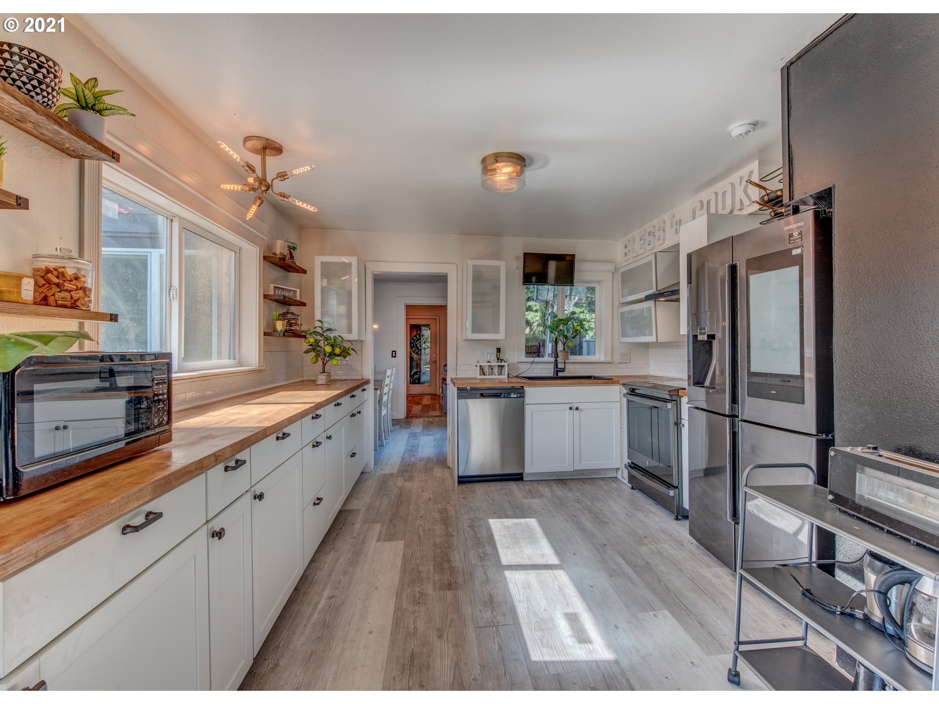 580 54th Street Springfield, OR 97478 - Photo 8 of 31 a large kitchen with a lot of counter space and stainless steel appliances