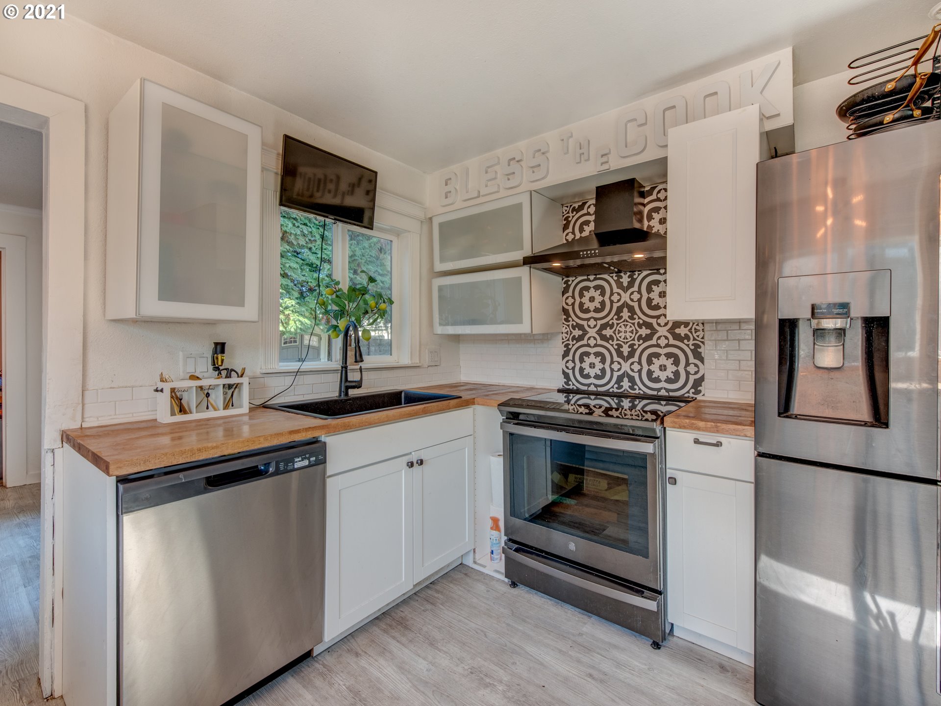 580 54th Street Springfield, OR 97478 - Photo 9 of 31 a kitchen with stainless steel appliances granite countertop a sink stove and refrigerator