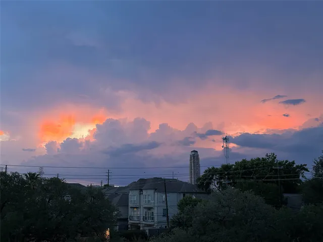 a view of a house with a swimming pool and a yard