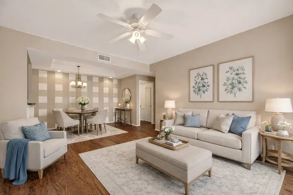a living room with furniture or couch and a lamp