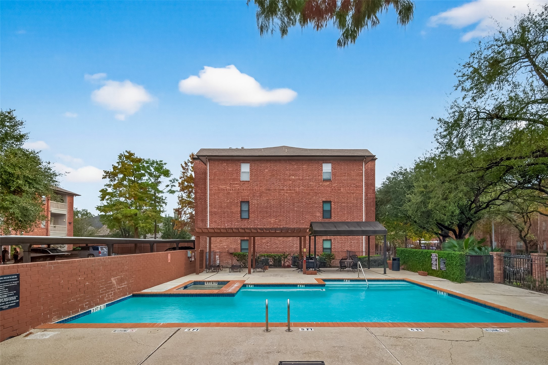 4041 Drake Street, Unit 118 Houston, TX 77005 - Photo 2 of 28 a view of a house with a swimming pool and a yard